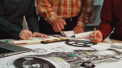 A group of engineers collaborates on a detailed technical blueprint in a modern office. Their engagement highlights teamwork, strategy, and innovation in project planning. SACTR