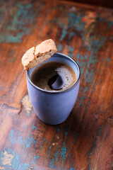 Cup of coffee on rustic wooden background. Soft focus. Copy space	