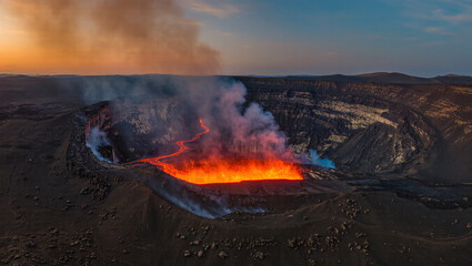 Dramatic Aerial View of Erupting Volcano Crater with Flowing Lava at Dusk