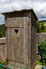 Rural toilet against the backdrop of the Austrian Alps. Austria