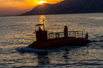 Tourist submarine at sunset in the Adriatic Sea. Croatia