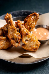 Golden fried chicken wings with dipping sauce
