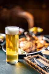 A refreshing glass of light beer with a full pub meal.