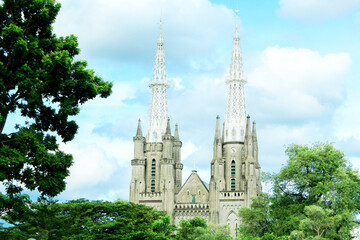 Beautiful view of the Cathedral Church, or officially named the Cathedral Church of the Assumption of the Blessed Virgin Mary in Jakarta, seen during the day	