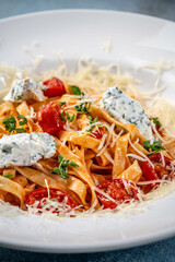 Close-up of Italian tagliatelle with ricotta and parmesan