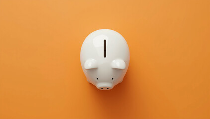 White Ceramic Piggy Bank on Bright Orange Background – Money Saving, Finance, Investment, Budget Concept