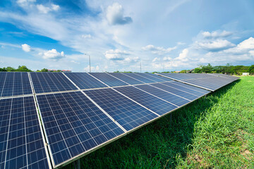 Photovoltaic solar power panel on dramatic sunset blue sky background, green clean Alternative power energy concept.