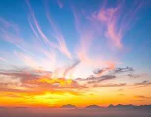 Colorful sunrise over misty mountains