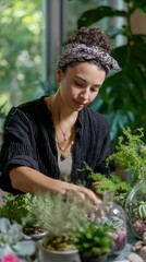 Young caucasian female gardening indoors surrounded by greenery and plants