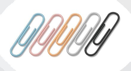 Colorful paper clips lined up on a white surface.