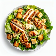 Elevated view showcasing a flavorful chicken caesar salad on a white background