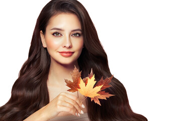 Portrait of beautiful young woman with autumn leafs. Healthy clean fresh skin natural make up.Long curly hairstyle. Care and beauty hair products