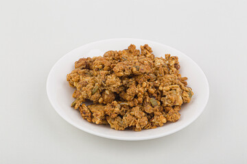heap of granola isolated on white background