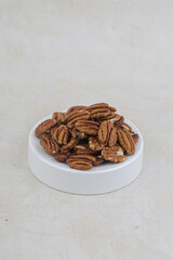 Many pecan nuts isolated on white, set