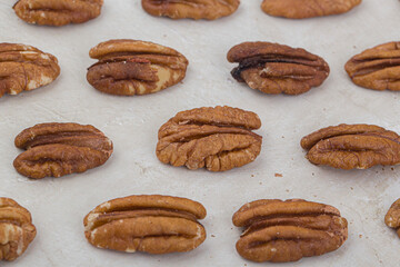 Many pecan nuts isolated on white, set