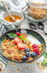 Granola bowl with yogurt and fresh berries