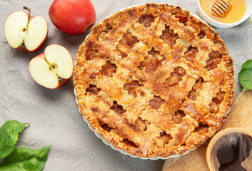 Delicious homemade apple pie with honey and coffee enjoyed during autumn season