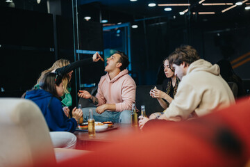 Friends gathered together, sharing food and laughter in a cozy modern space, creating memorable moments during a casual indoor meal