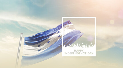 Honduras flag waving proudly under a bright sky with text happy independence day. Honduras national...