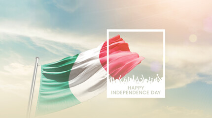 Italy flag waving proudly under a bright sky with text happy independence day. Italy national flag...