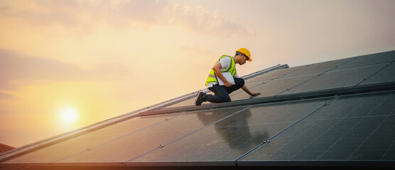 man in  yellow helmet and  reflective vest is working on  solar panel