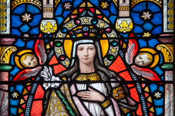 Stained glass (19th century) of Virgin Mary at prayer.