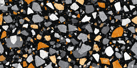 A close-up view of a textured surface showcasing a mix of small, irregularly shaped stones in shades of black, white, and orange, ideal for design and construction projects