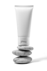 White plastic cream tube with stone for mockup isolated on white background. Selective Focus.