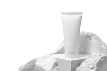 White plastic cream tube with stone for mockup isolated on white background. Selective Focus.
