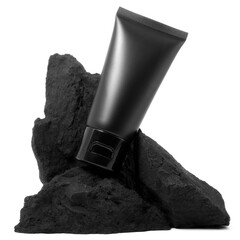 Black plastic cream tube with stone for mockup isolated on white background. Selective Focus.