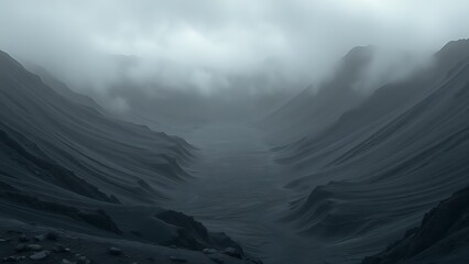 Winter peaks cloaked in morning mist and clouds, a panoramic view of the vast mountain landscape under a moody sky