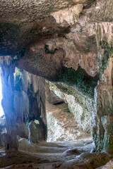 Limestone cave inside and sunlight. Cavern interior in Thailand, soft selective focus © dmf87