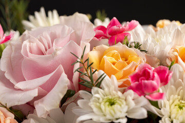 a beautiful gift arrangement of a large variety of flowers of different colors, a flower arrangement for giving from different colors and different types of flowers