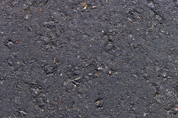 details of the new asphalt on the highway, part of the newly built asphalt highway made of bitumen with crushed stone and sand