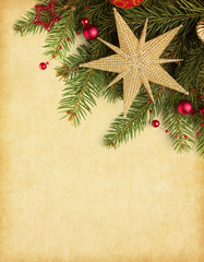  Vintage  Christmas and New Year holidays background. Fir branch with red and gold Christmas ornaments on  aged paper background.  Flat lay.