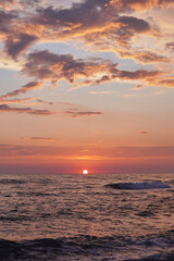 Vertical shot of a beautiful view of the sea at sunset in Belved