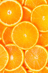 Slices of oranges close-up. Vertical photo. Top view.