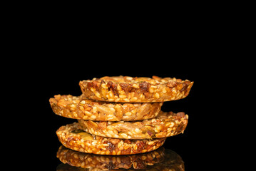 Thaler cookies with nuts and honey isolated on black background, close-up.
