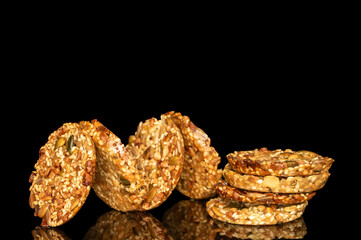 Thaler cookies with nuts and honey isolated on black background, close-up.