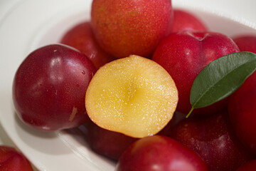Red plums, isolated on white background