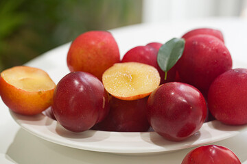 Red plums, isolated on white background