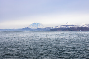 blue gray sky over bay shore in Pacific ocean