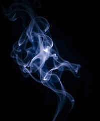 Whispers of the Ether: Intricate wisps of ethereal smoke dance and swirl, a captivating display of light, shadow, and delicate form. This artful image captures the ephemeral beauty of smoke.