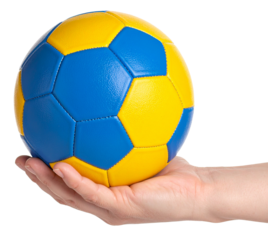 hand holding a handball in blue yellow color isolated on white background