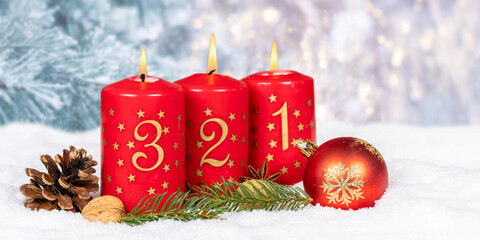 Third 3rd Sunday in advent Christmas time copyspace copy space with burning candle snow winter panorama