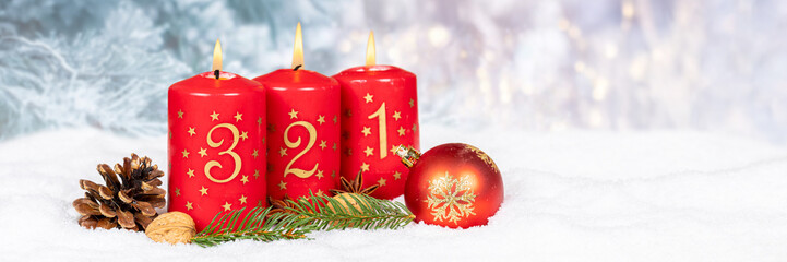 Third 3rd Sunday in advent Christmas time panorama copyspace copy space with burning candle snow winter