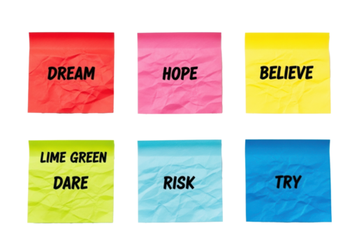 Six crumpled, vibrant sticky notes with motivational words, arranged in a 2x3 grid, top-down on a white background with studio light. Concept of motivation and inspiration