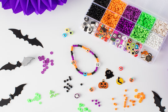 A set of multicolored beads for making handmade Halloween bracelets. 