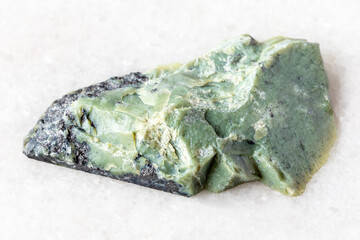 sample of raw teyskiy jade rock on white marble © vvoe