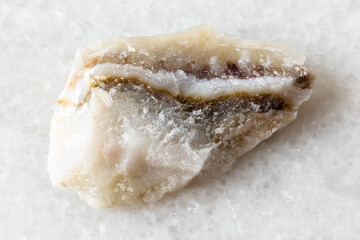 sample of raw shaitan perelivte rock on white